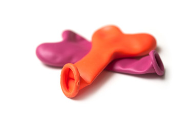 Closeup of colorful inflatable balloons on white background