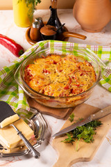 Potatoes baked with tomatoes and sweet peppers