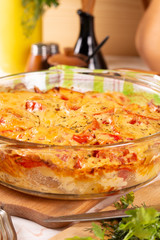 Potatoes baked with tomatoes and sweet peppers