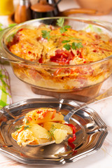 Potatoes baked with tomatoes and sweet peppers
