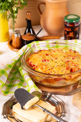 Potatoes baked with tomatoes and sweet peppers