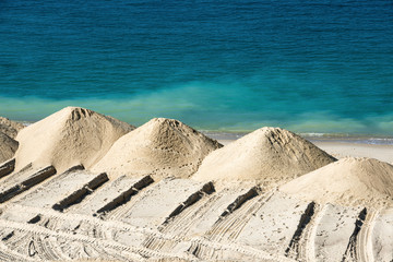 Heaps of sand on a sea coast.