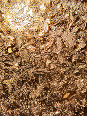 Beautiful frozen patterns on glass, macro photo. The concept of winter, the beauty of nature, frost, cold. Abstract background image.