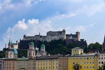 Fototapeta na wymiar The fortress Hohensalzburg is resting on a high cliff in the city center of Salzburg, Austria