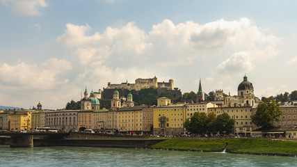 Fototapeta na wymiar A vintage post card like view of the Salzach river, Salzburg and the fortress Hohensalzburg