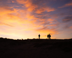 People walking in the dunes II