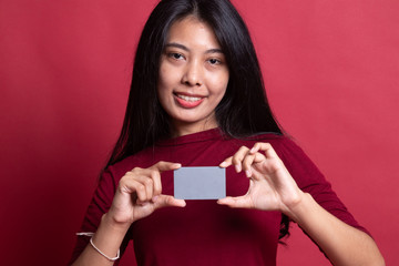 Young Asian woman smile with  blank card.