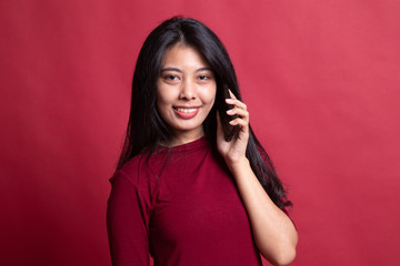 Young Asian woman talking with mobile phone.