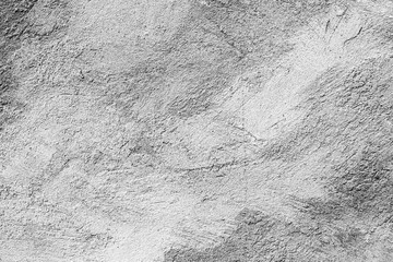 Texture of a concrete wall with cracks and scratches which can be used as a background