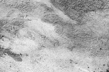 Texture of a concrete wall with cracks and scratches which can be used as a background