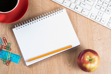 Stationery stuff on wooden table from top view