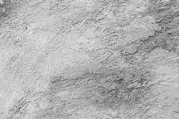 Texture of a concrete wall with cracks and scratches which can be used as a background