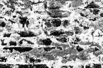 Obraz premium Texture of a brick wall with cracks and scratches which can be used as a background
