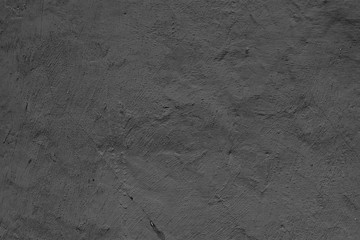 Texture of a concrete wall with cracks and scratches which can be used as a background