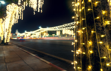 Landscape of the night city. Bangkok at night. Garlands along the road. Blurred background.