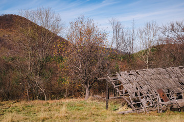 Romanian old sheepfold on the top of the hill in the fall season, Fantanele village, Sibiu county, Cindrel mountains, 1100m, Romania