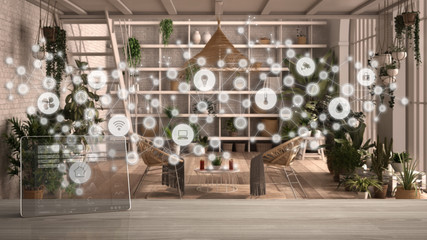 Tablet wireless with smart home app on wooden table, geometric background with connected line and dots showing internet of things system, home automation concept over conservatory