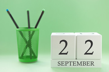 Desk calendar of two cubes for September 22