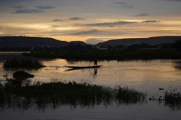 Fisherman On The River Niger In Mali Returning Home in The Evening