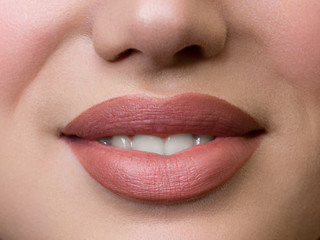Smiling young girl. Beauty face closeup. Sexy lips. Beauty natural lip makeup detail. Beautiful make-up close-up. Sensual open mouth with teeth. Lipstick and lipgloss