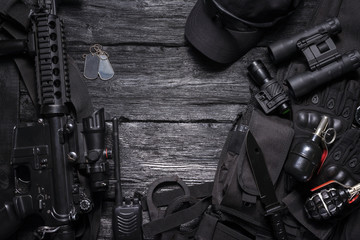 Rifle, radio station, binoculars, handcuffs, knife on the special force agent table with copy space concept. - obrazy, fototapety, plakaty