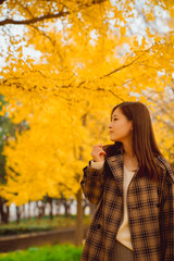 Autumn, girls and yellow gingko leaves