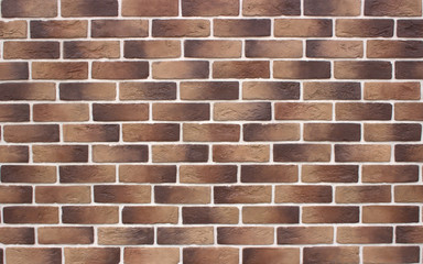 Obraz premium Image of brickwork with a transition of color from light brown to dark brown. Bavarian masonry. Each element is separated by a white stripe.