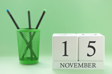 Desk calendar of two cubes for November 15