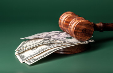 Law mallet and a stack of money
