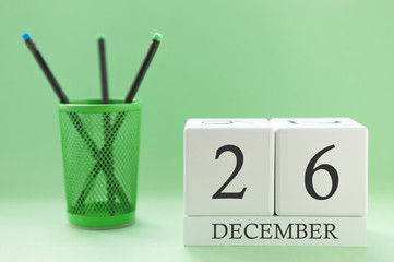 Desk calendar of two cubes for December 26