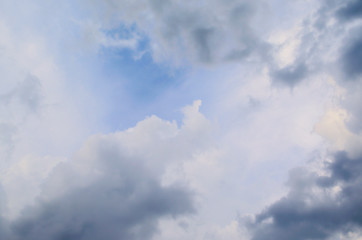 Obraz premium Blue sky and fluffy clouds. Beautiful cloudscape background. Sunlight on the clouds. Blue gradient.