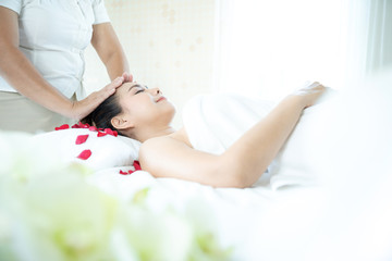 Obraz na płótnie Canvas Beautiful woman in spa. relaxing massage. young beautiful female in spa. Asian woman in wellness beauty spa having aroma therapy massage with essential oil. Thailand.
