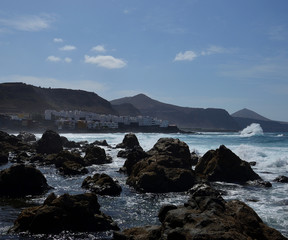 Fototapeta na wymiar Large rocks at low tide, coast of Moya, north of Gran Canaria, Spain
