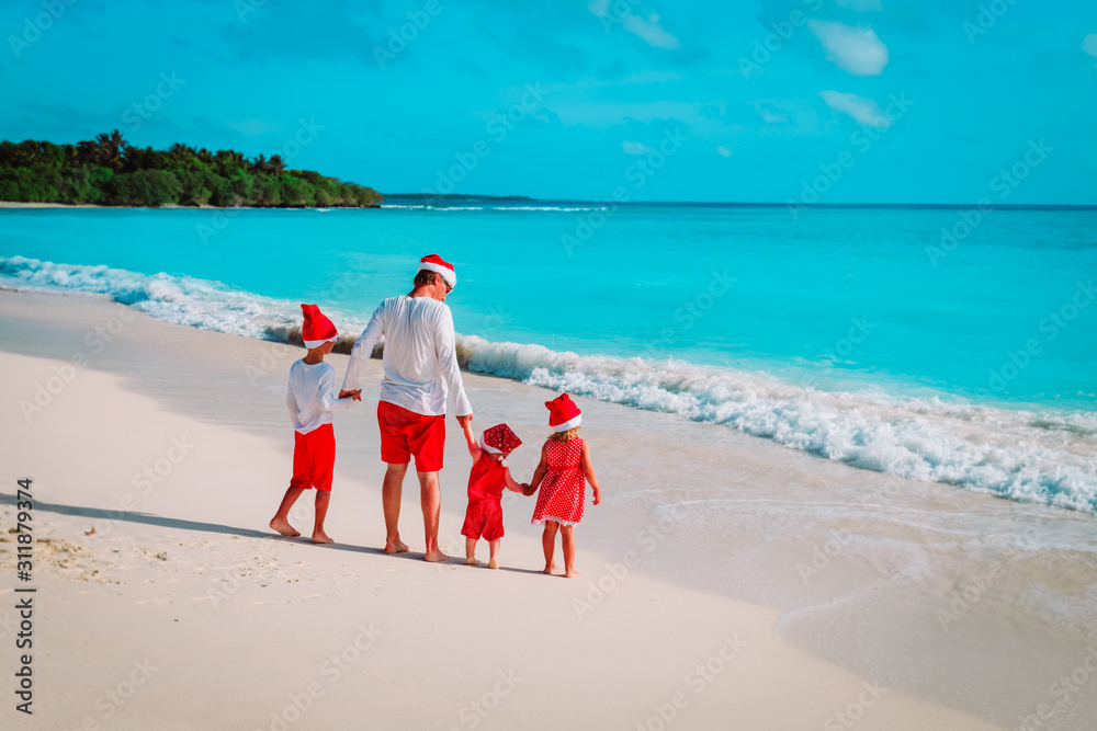 Wall mural father with kids on tropical christmas vacation