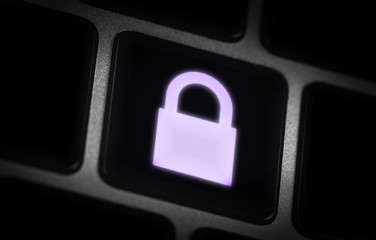 glowing lock icon on the button in the dark closeup