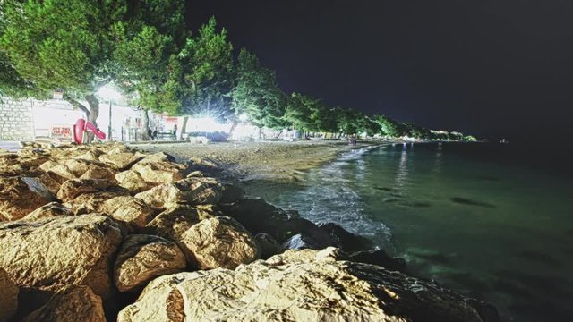HDR - Tucepi, Croatia - Aug 18, 2018: Time Lapse 4K view of the sea line of the beach