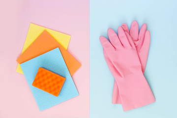 Rubber glove, rags and sponge for dishwashing isolated on a pink and blue background. Cleaning service concept. Top view, flat lay.