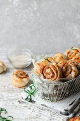 Unsweetened snails and puff pastry with bacon, sesame seeds and rosemary.