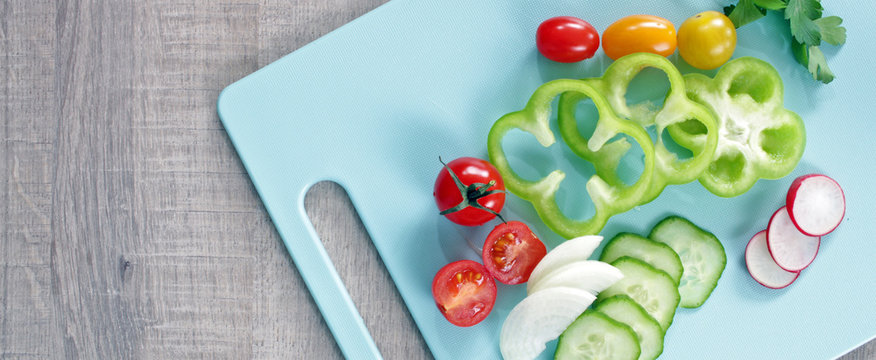 Colorful vegetables on cutting board with copy space