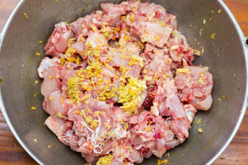 slice raw chicken is marinated for cooking