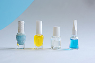 A set of nail care products. Bottles with multi-colored means for manicure.