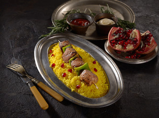 kebab with rice on a dark background