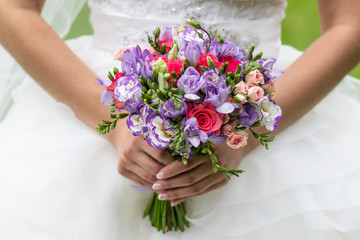 Obraz na płótnie Canvas wedding bouquet of flowers in the hands of the bride, wedding