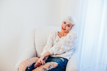 beautiful blonde woman with short book reads book training