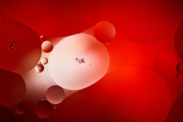 abstract red color background from mixed water and oil bubbles