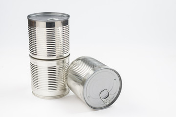Group of silver canned food on white background.