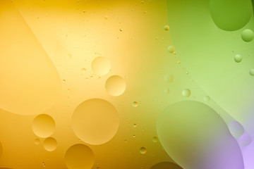 Beautiful orange, purple and green color abstract background from mixed water and oil