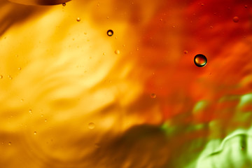 Beautiful abstract orange, red and green color background from mixed water and oil