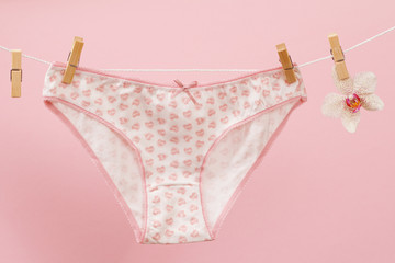 Beautiful women's cotton panties on pink background.