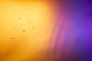 abstract orange and purple color background from mixed water and oil